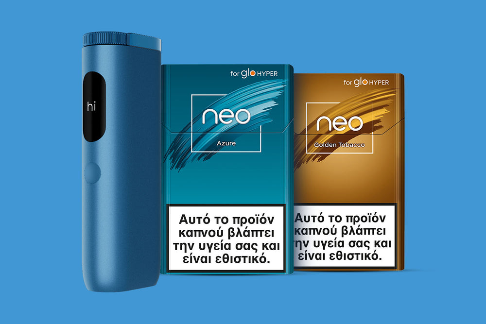 A blue electronic device stands next to two cigarette packs labeled neo Azure and neo Golden Tobacco, both featuring Greek health warnings on the front, against a light blue background.