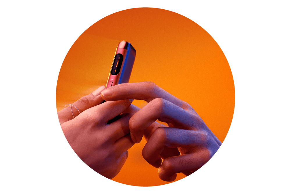Two hands exchange a small, sleek, metallic electronic device against an orange gradient background, highlighting the gesture and modern design.