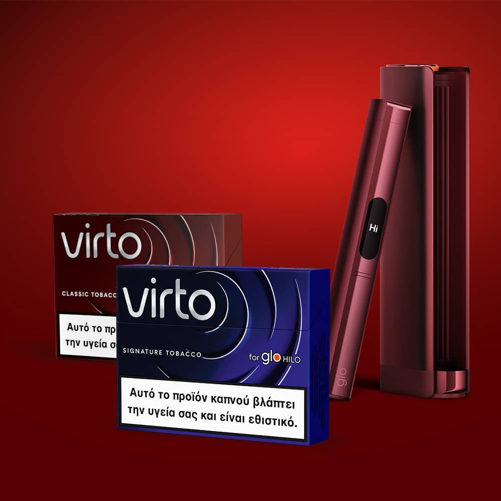 Two packs of Virto tobacco sticks, one in brown and one in blue, are displayed in front of two sleek electronic tobacco devices on a red gradient background. Warning labels in Greek are visible on the packs.
