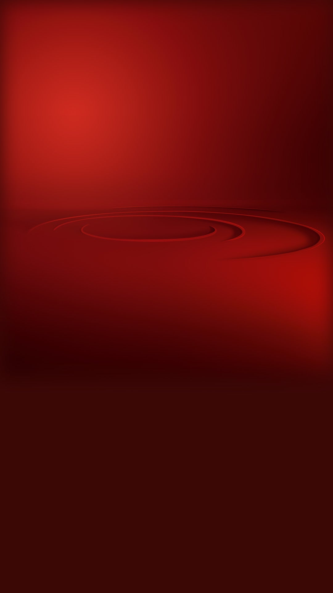 A deep red abstract background with smooth gradients and subtle concentric circular grooves near the center, fading to darker shades at the bottom.