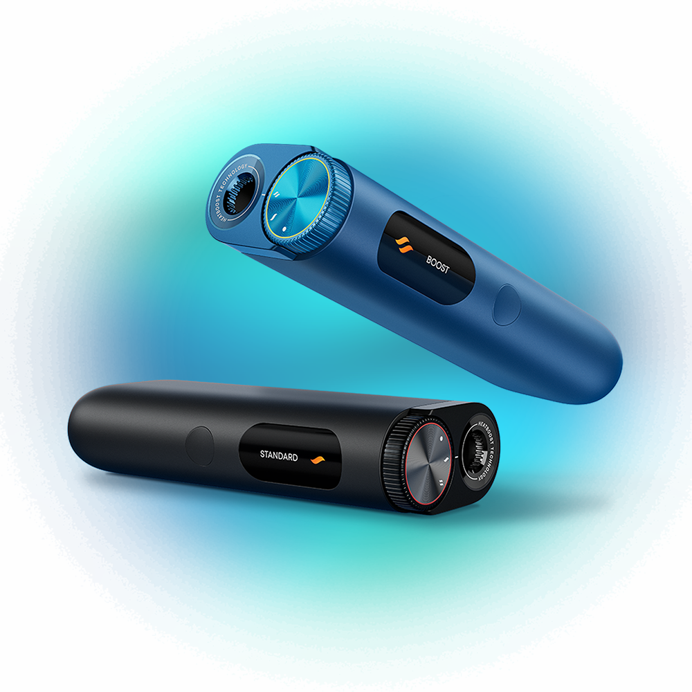 Two sleek electronic devices, one blue labeled BOOST and one black labeled STANDARD, featuring circular dials and digital displays, floating against a gradient blue background.