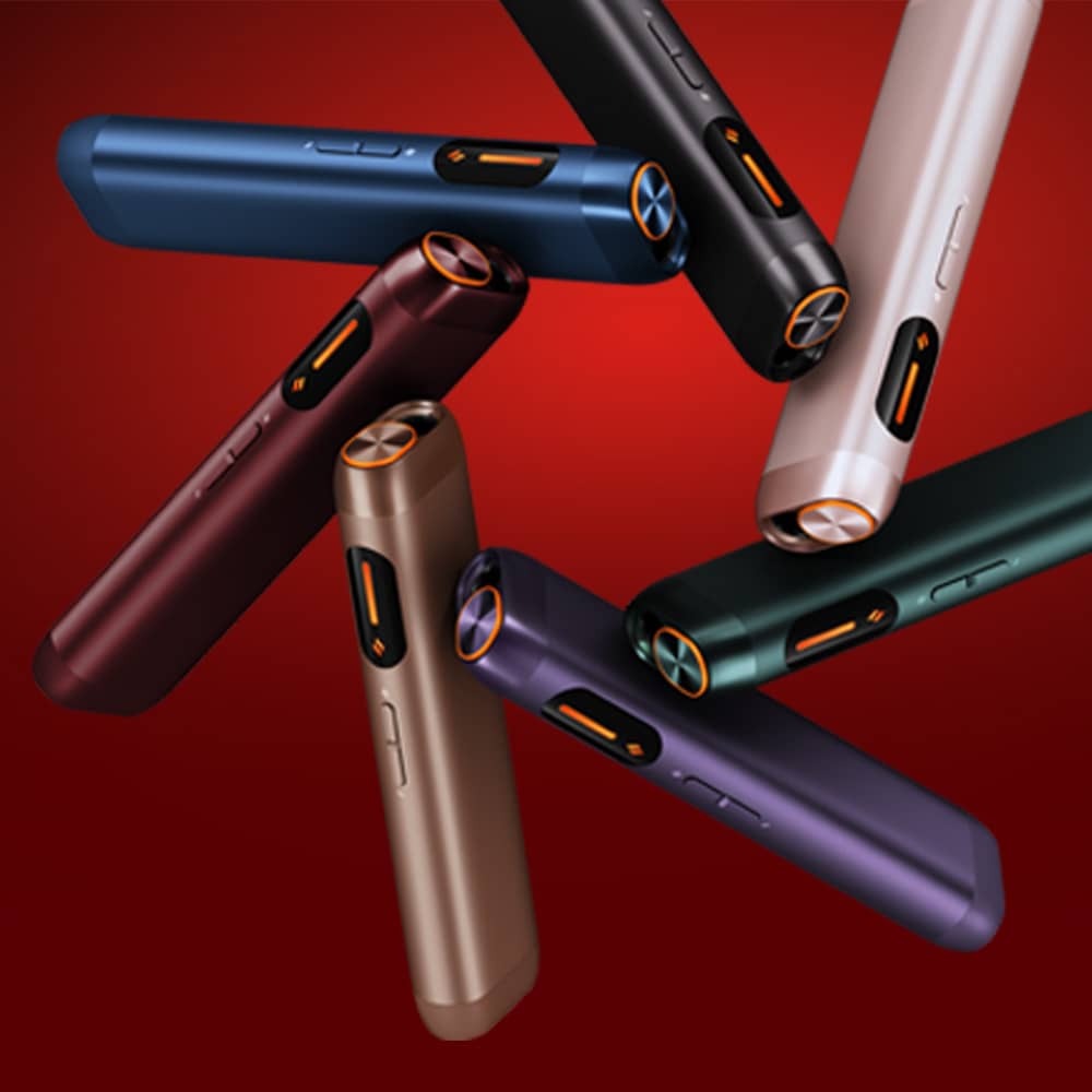 Several colorful, sleek electronic devices with buttons and circular ends are arranged in a dynamic pattern against a red gradient background.