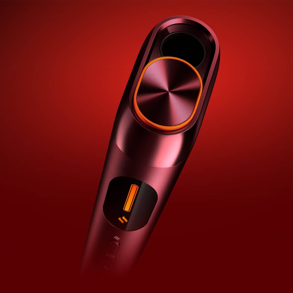 A sleek, metallic red electronic device with an orange circular button and a matching slider, set against a gradient red background. The design appears modern and stylish.