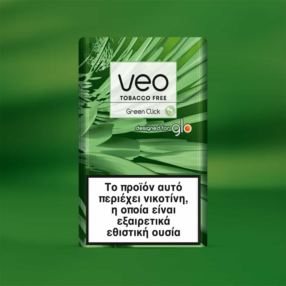 A green packet of veo™ Green Click for Glo stands upright. A white warning label in Greek says it contains nicotine, which is highly addictive. Green leaf patterns decorate the background.