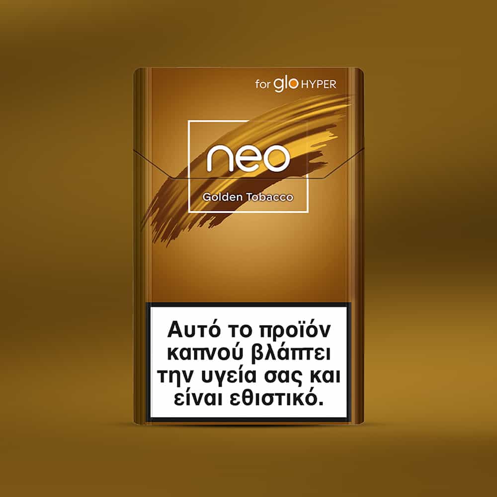 A golden-brown neo™ Golden Tobacco cigarette pack with Greek text warning at the bottom—smoking is harmful and addictive—set against a matching golden background.
