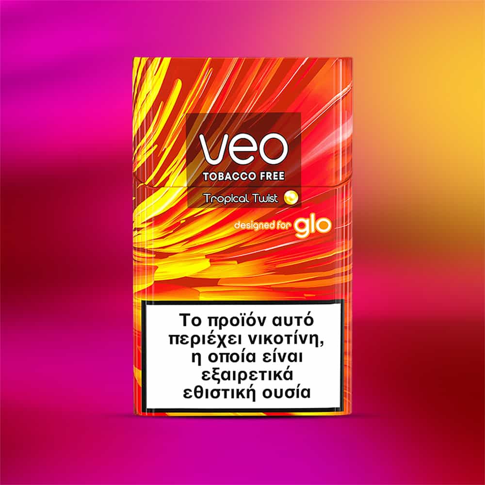 A vibrant pack of veo™ Tropical Twist for Glo, featuring a Greek warning label about nicotine addiction. The packaging has a pink, purple, and yellow gradient background.