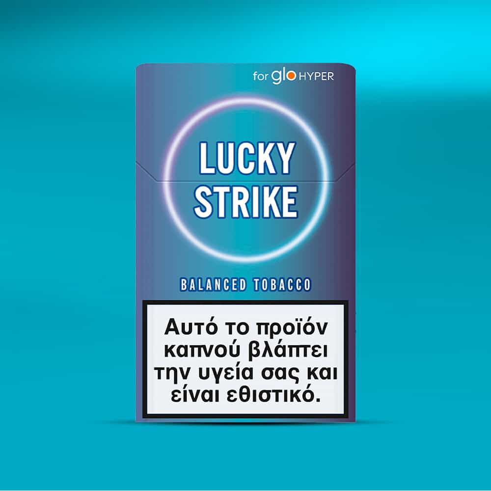 Lucky Strike Balanced Tobacco for glo HYPER in blue packaging with a Greek warning label: "Αυτό το προϊόν καπνού βλάπτει την υγεία σας και είναι εθιστικό." Offers a warm, tobacco-dominant, mid-intensity experience.