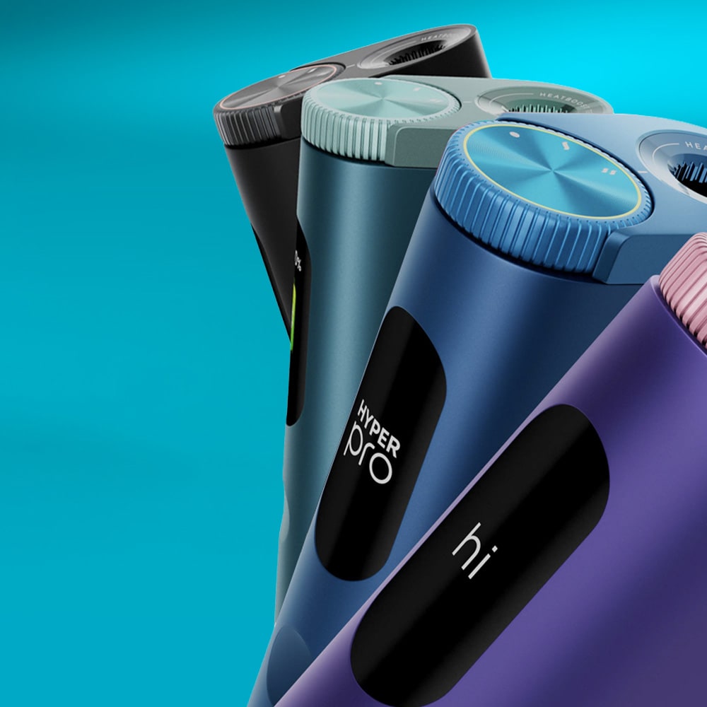 Four glo™ HYPER PRO electric shavers, each with a sleek modern design, visible power buttons, and rotary shaving heads, are arranged diagonally against a blue background.