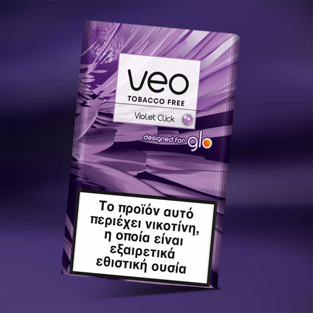 A purple box of veo™ Violet Click with a Greek health warning label stating it contains nicotine, which is highly addictive, and featuring the designed for glo logo.