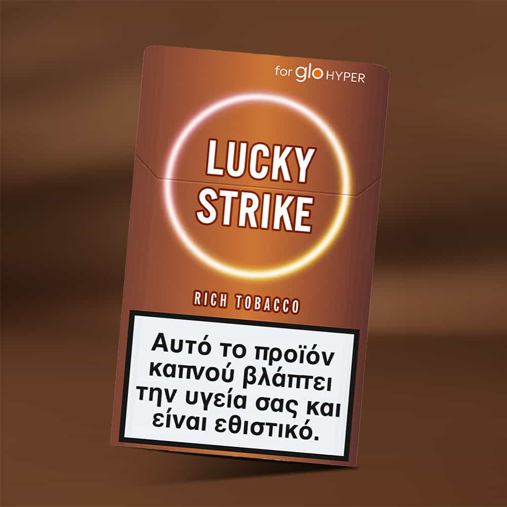 Lucky Strike Rich Tobacco for glo HYPER features Burley notes and a Greek health warning label indicating the product is harmful and addictive, displayed on a brown background.