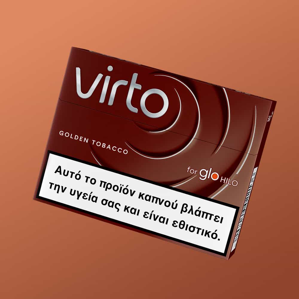 A pack of virto™ Golden Tobacco for glo Hilo is shown on a brown background with a Greek health warning label indicating the product is harmful and addictive.