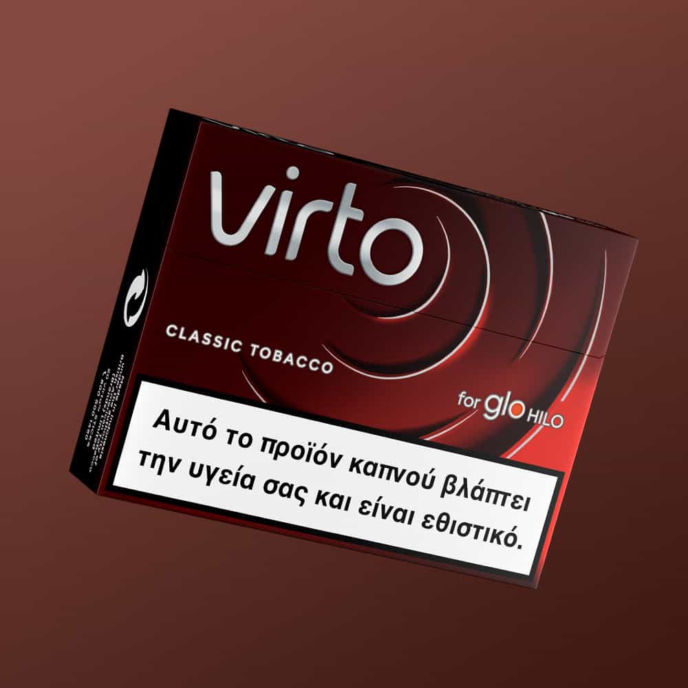 A red box of virto™ Classic Tobacco for glo HILO features a Greek warning stating the product is harmful to health and addictive.