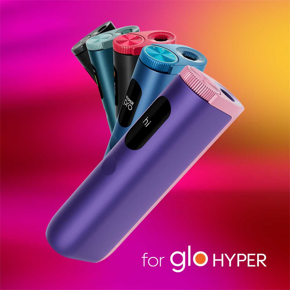 Several sleek, colorful veo™ Blossom Twist devices are arranged against a vibrant pink and yellow gradient background. The text for veo™ Blossom Twist appears at the bottom right of the image.