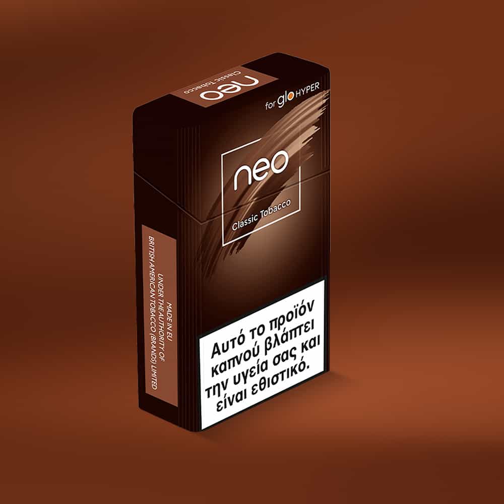 A brown pack of neo™ Classic Tobacco for glo HYPER stands upright on a brown surface, displaying a white Greek warning label on its front.