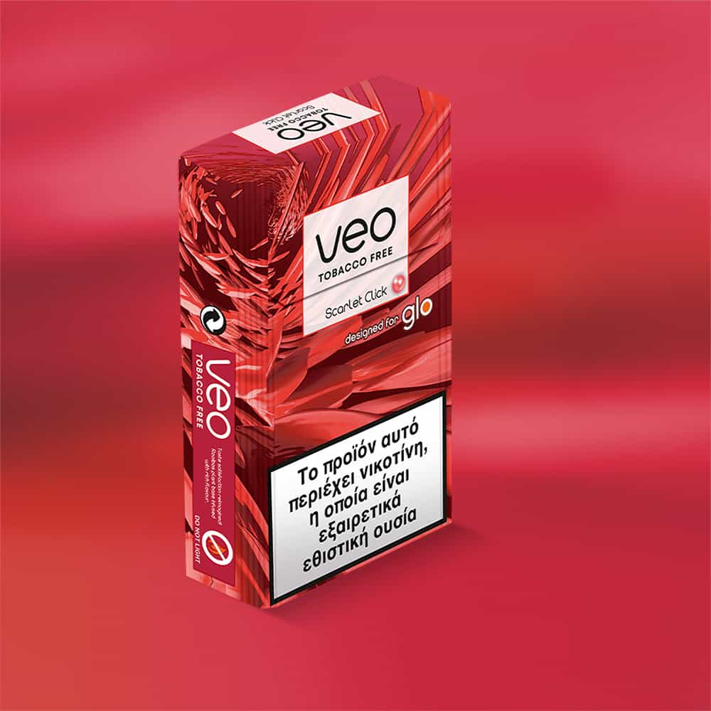 A veo™ Scarlet Click tobacco-free heated sticks pack with Greek health warnings is displayed on a red gradient background, featuring abstract red patterns and the Glo logo.