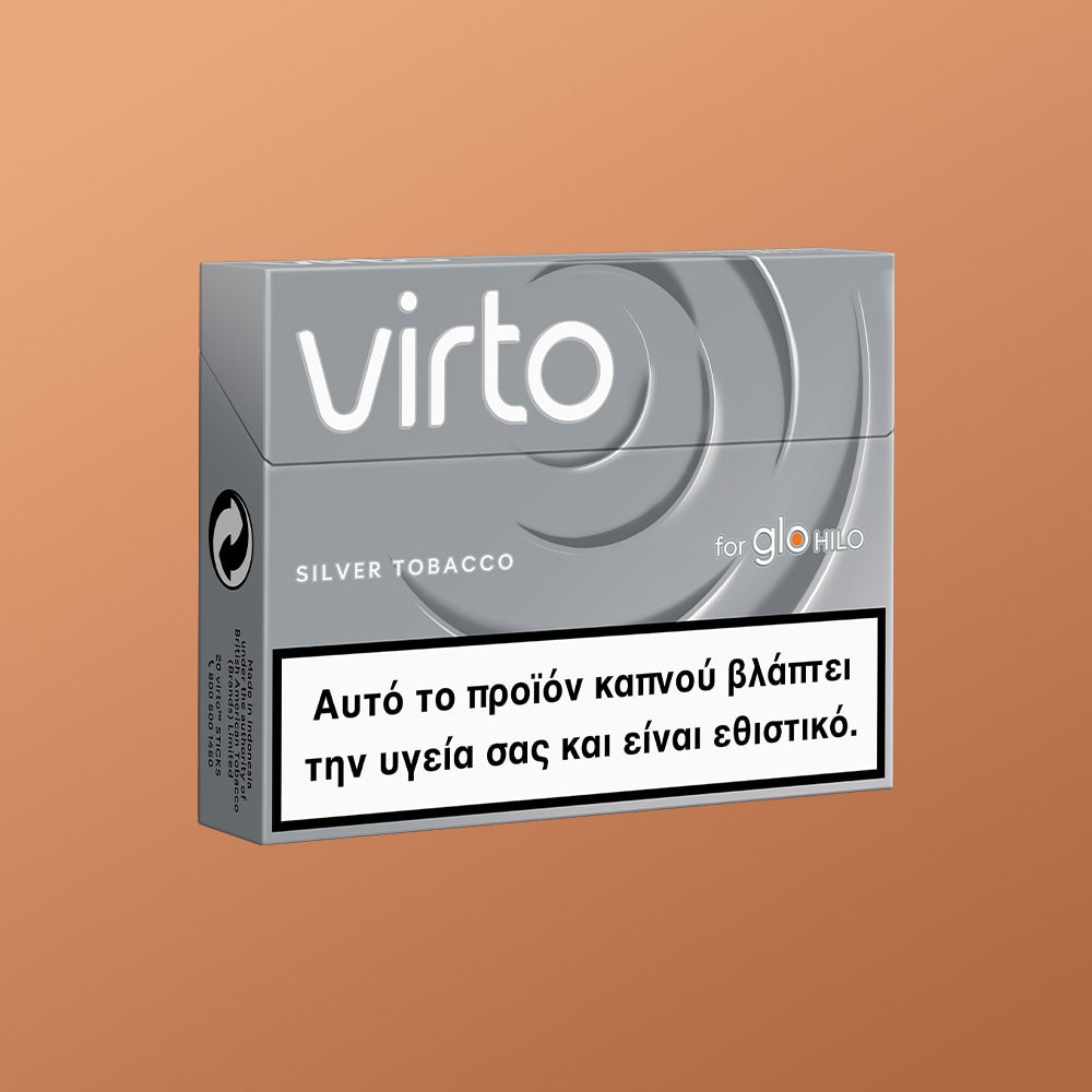 A pack of virto™ Silver Tobacco for glo HILO is shown on an orange background. The Greek warning label says: Αυτό το προϊόν καπνού βλάπτει την υγεία σας και είναι εθιστικό.