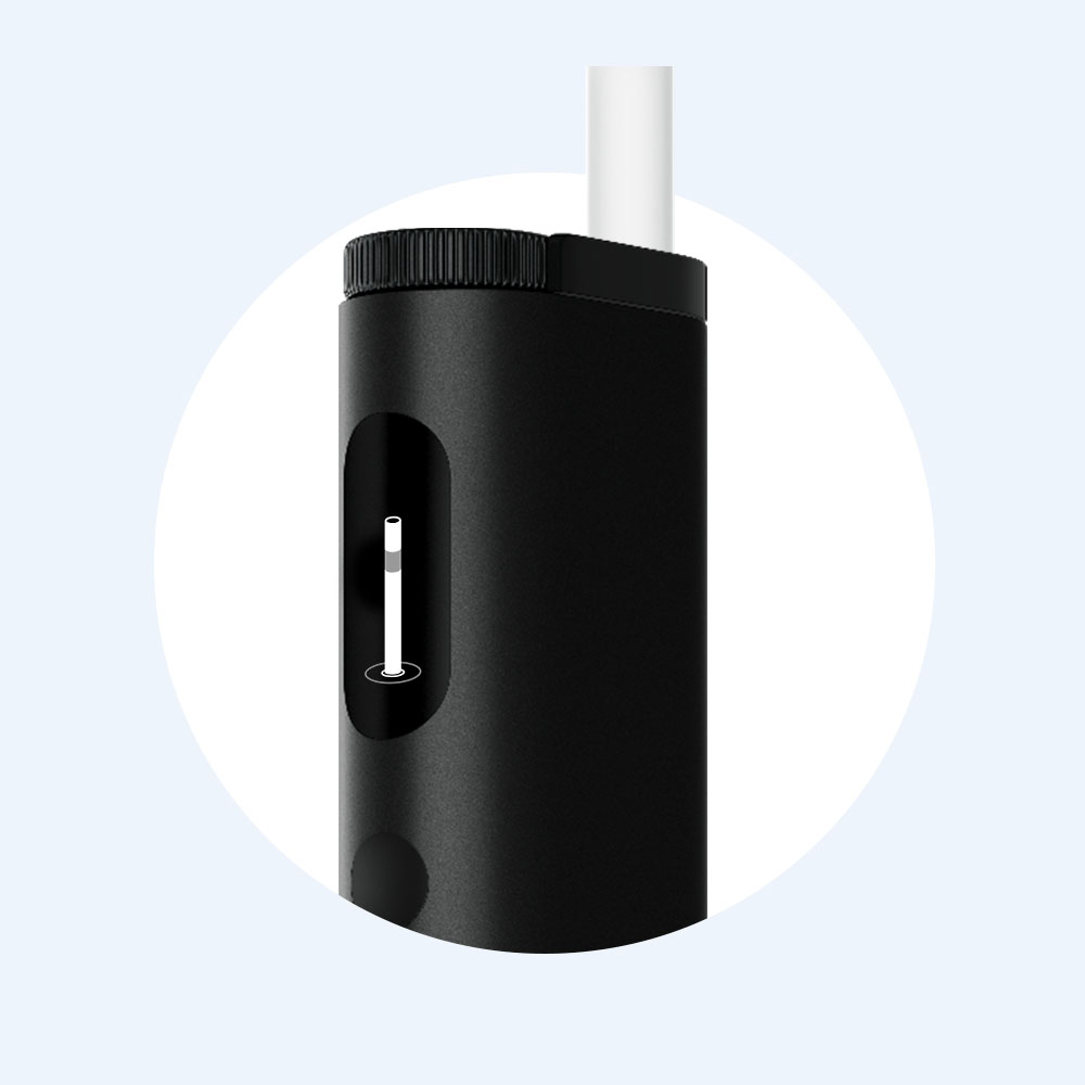 A close-up of a sleek black cylindrical device with a small window showing a white level indicator, and a white tube or straw extending from the top. The background is a light blue circle.