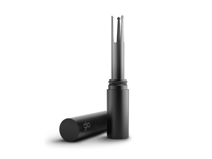 A black cylindrical tool with a cap, featuring a metal tip with prongs, stands upright next to its removed cap, which is labeled glo, against a plain white background.