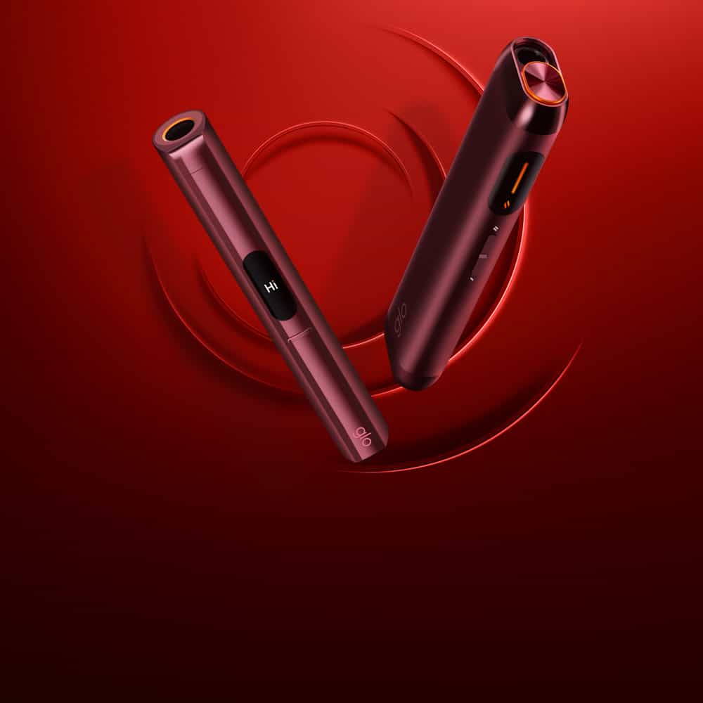 Two sleek, red electronic devices with rounded edges are displayed against a red background with swirling patterns. One device shows a small screen with the text HI.