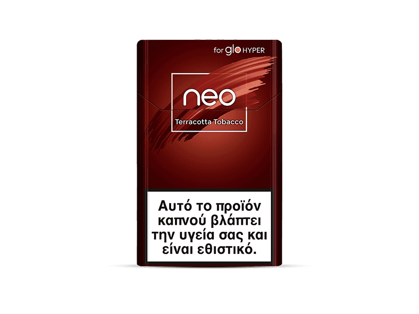 A red cigarette pack labeled neo™ Terracotta Tobacco with a large white health warning in Greek at the bottom, stating that this tobacco product damages health and is addictive.