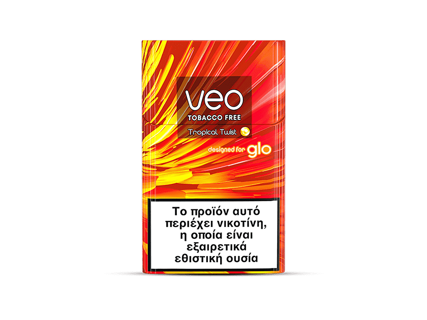 A colorful rectangular box labeled veo™ Tropical Twist displays a Greek warning on the front: "This product contains nicotine, which is a highly addictive substance.